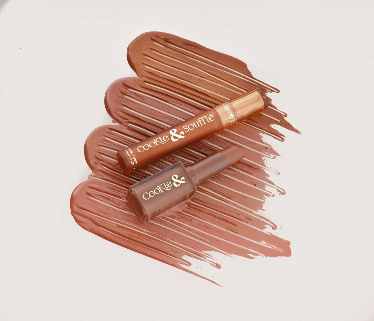 Side-by-side comparison of three lip contour crayons: creamy, waxy, and liquid formulas showing application smoothness and blendability on skin swatches