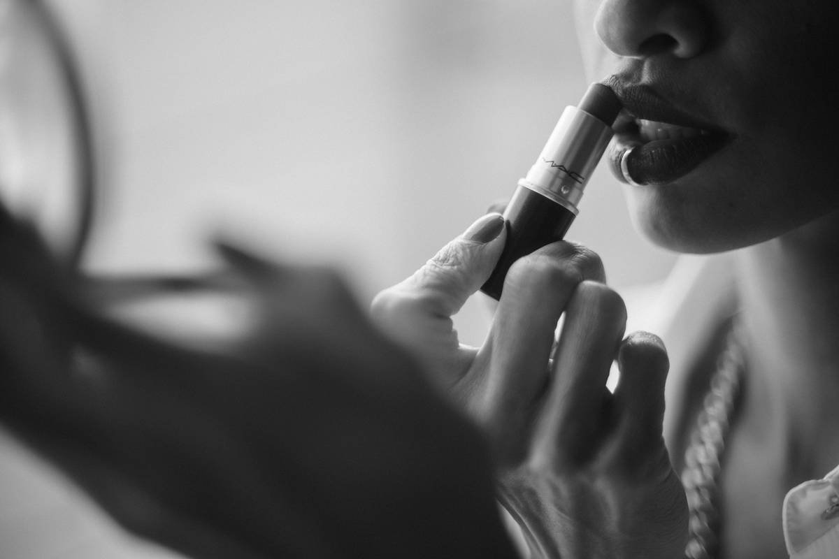 Close-up of flawless lip contour pencil application on model's lips showing sharp definition and even fill